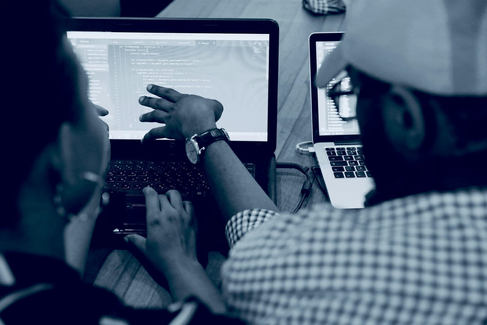 A software development team reviews code together.